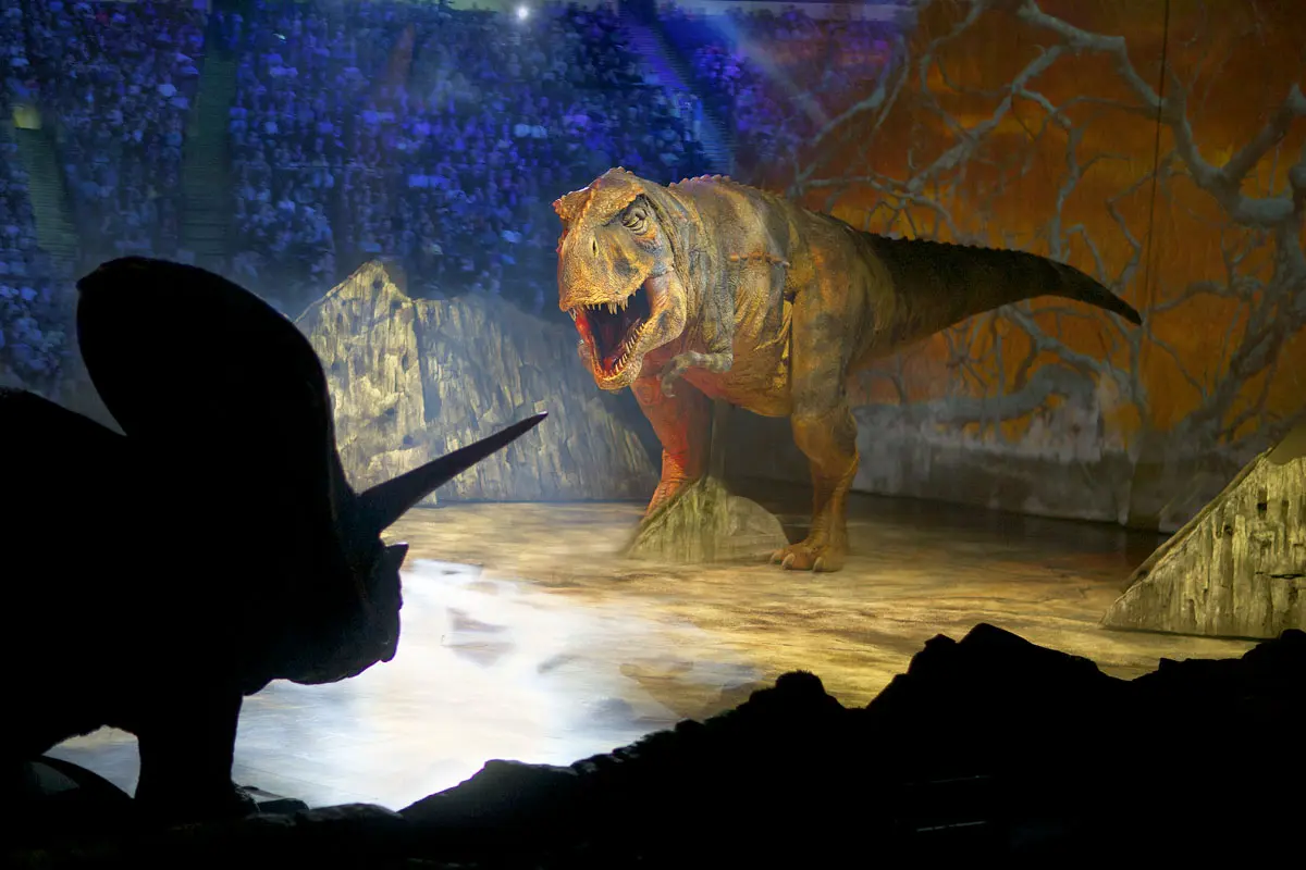 T-rex and Triceratops facing off in Walking with Dinosaurs live arena show