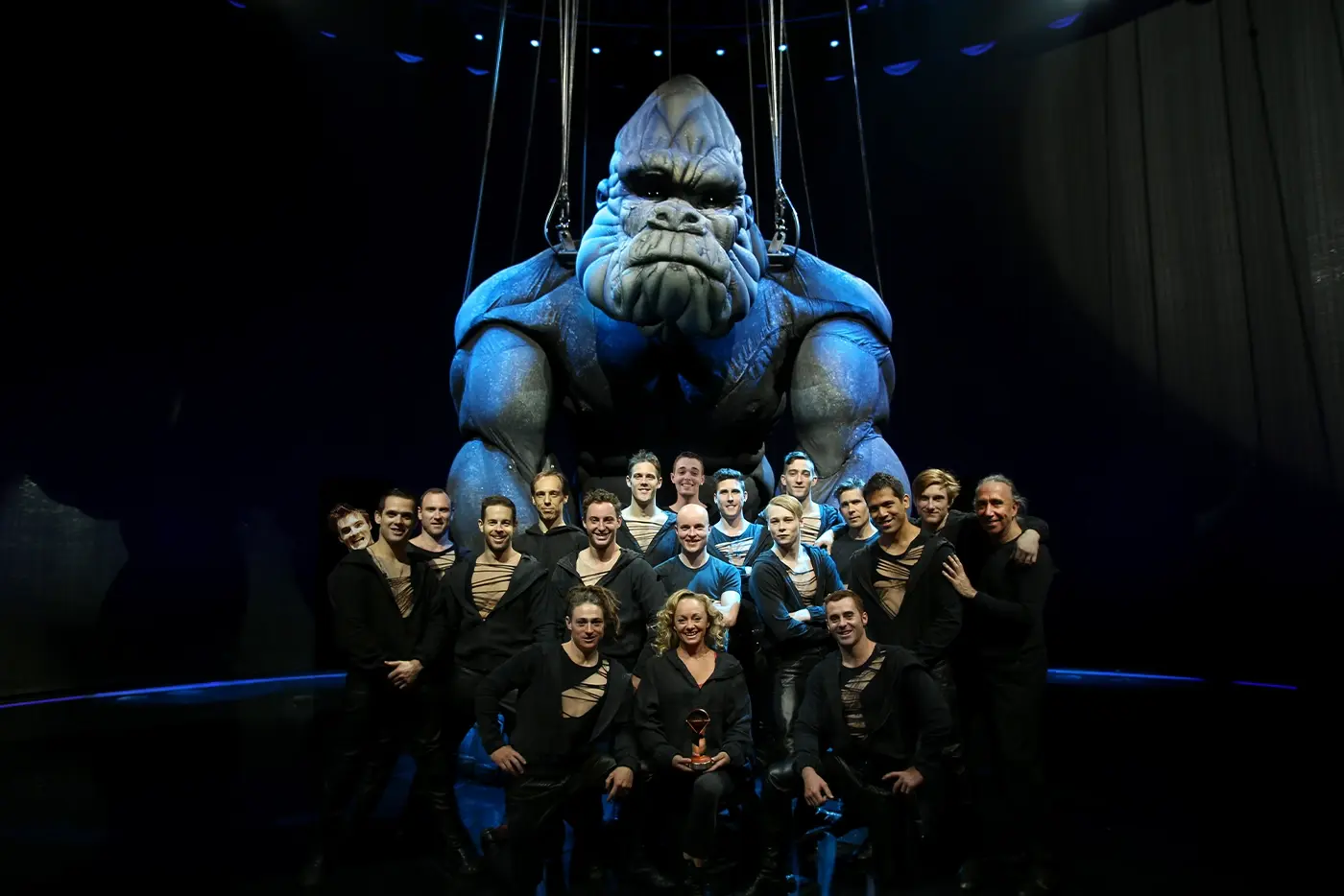 Giant King Kong on stage with cast standing in front Global Creatures production in Melbourne 2013