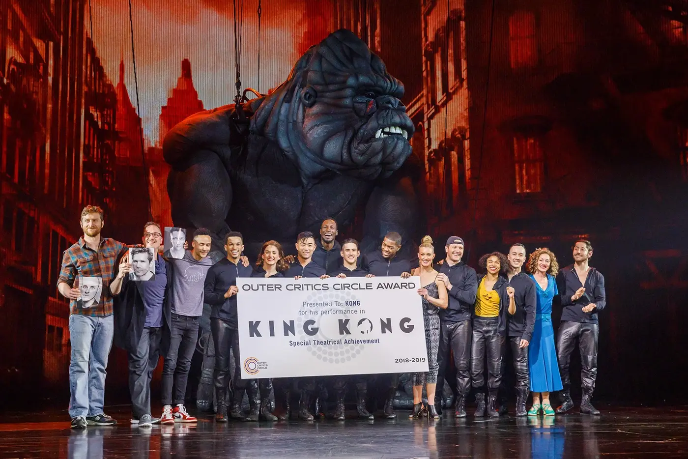The cast of King Kong on Broadway posing on stage with their Outer Critics Circle Award