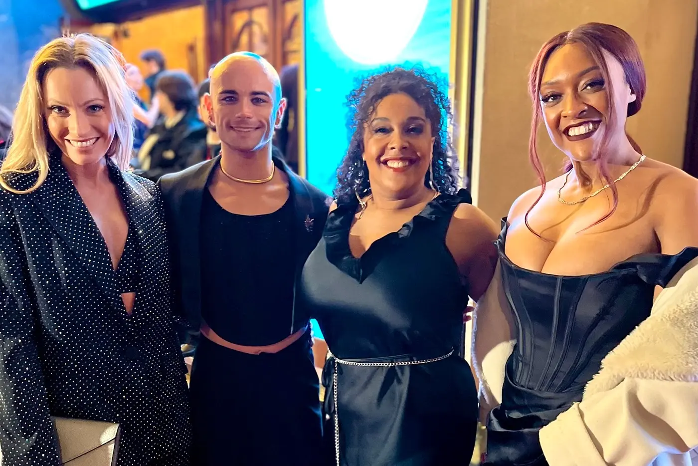 The West End Lady Ms posing in formal attire at the WhatsOnStage Awards