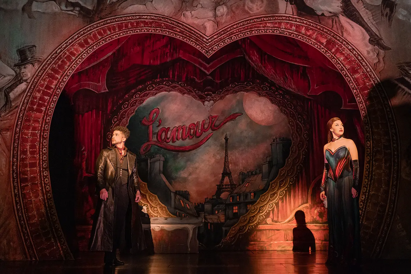 Scene from Moulin Rouge! The Musical (Broadway cast) with Christian (played by Jordan Fisher) on the left, and Satine (played by Solea Pfeiffer) on the right.