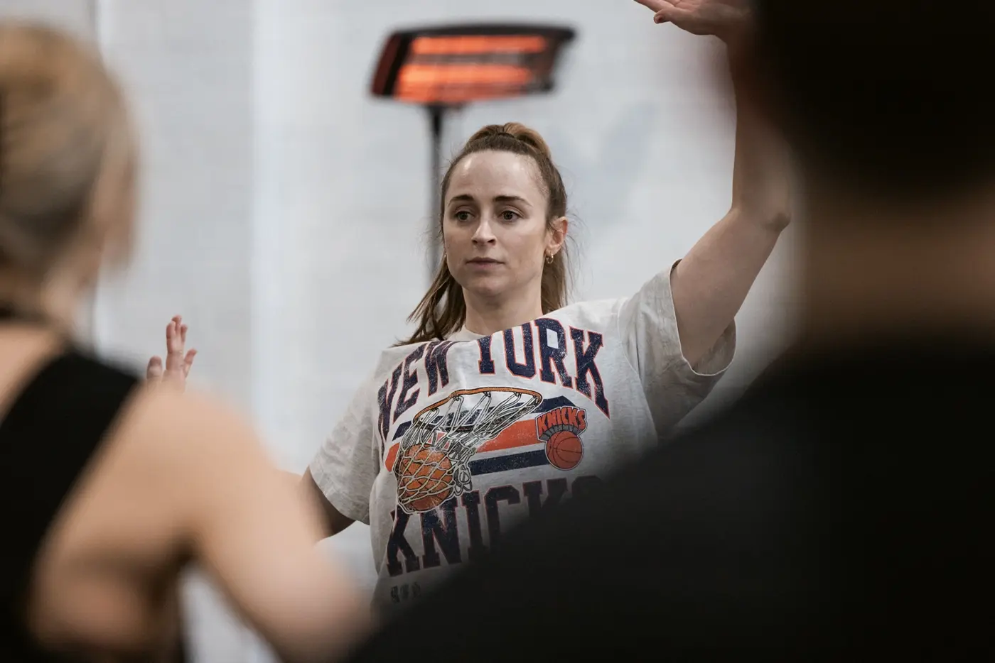 Danielle Bilios, Associate Choreographer of Moulin Rouge! The Musical Australia, striking a dance pose during rehearsals.
