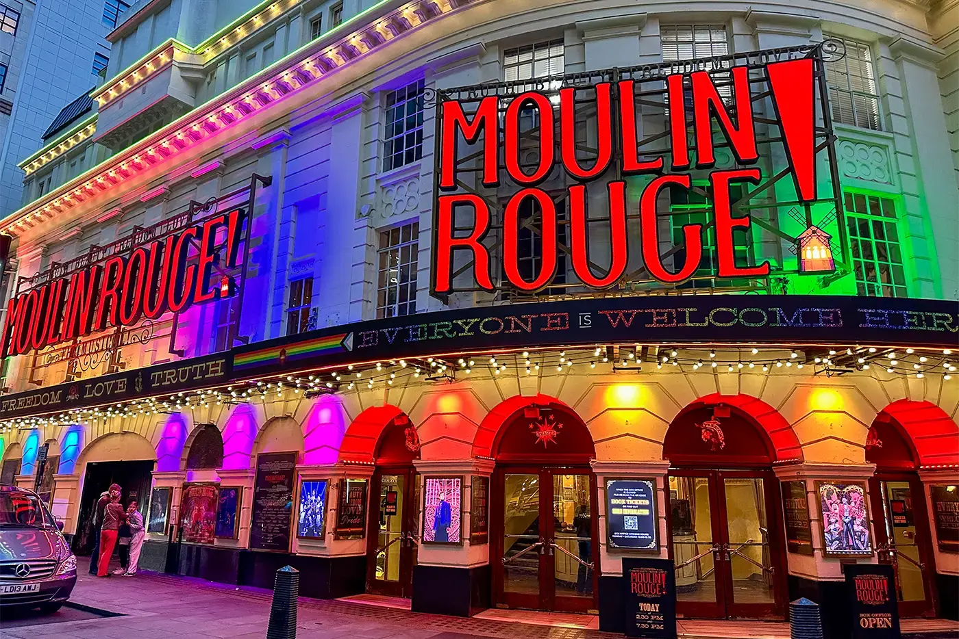Moulin Rouge! The Musical at the Piccadilly Theatre during Pride Month, lit up in rainbow colour