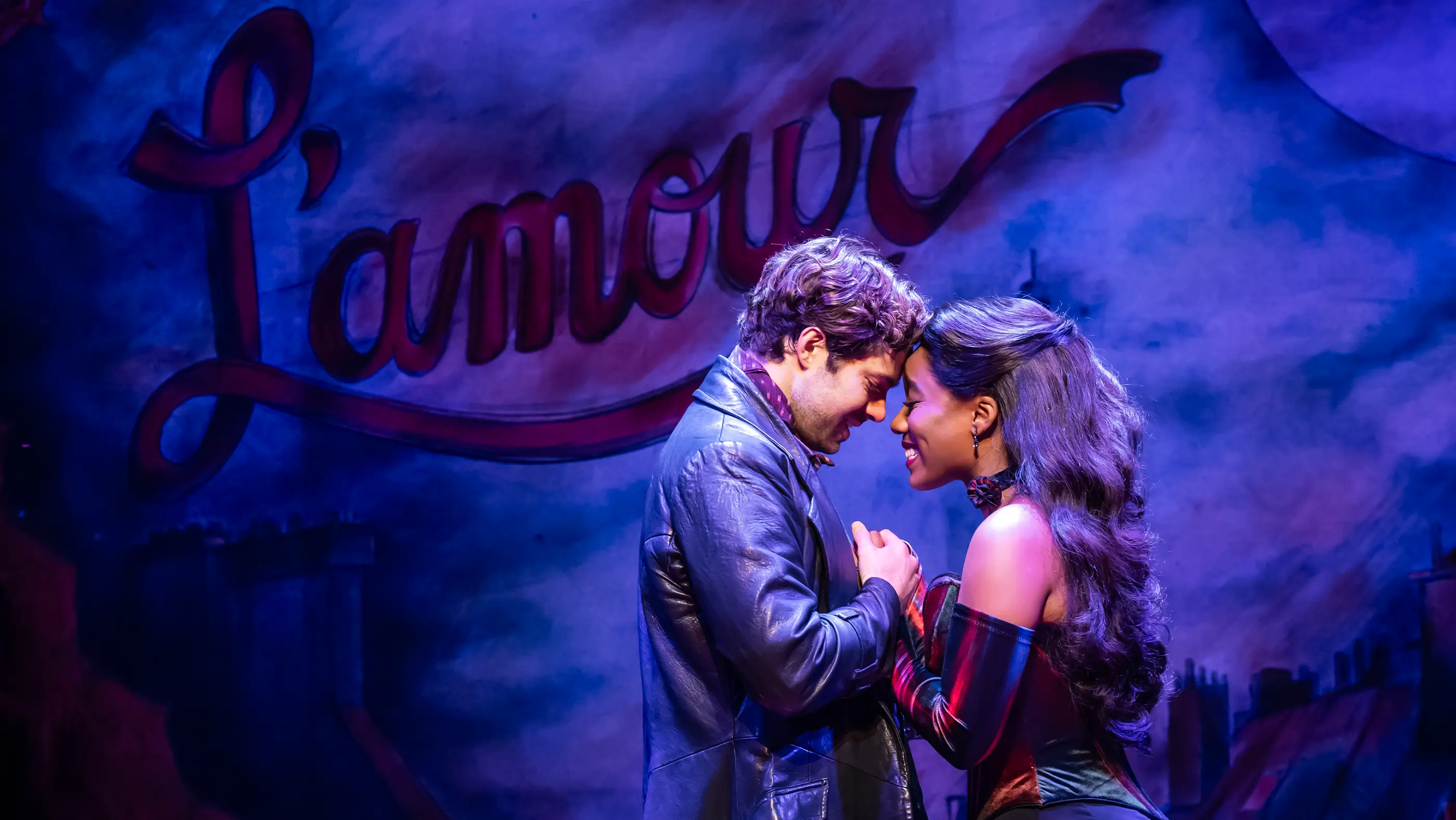 The West End Christian and Satine smiling as they in Moulin Rouge! The Musical