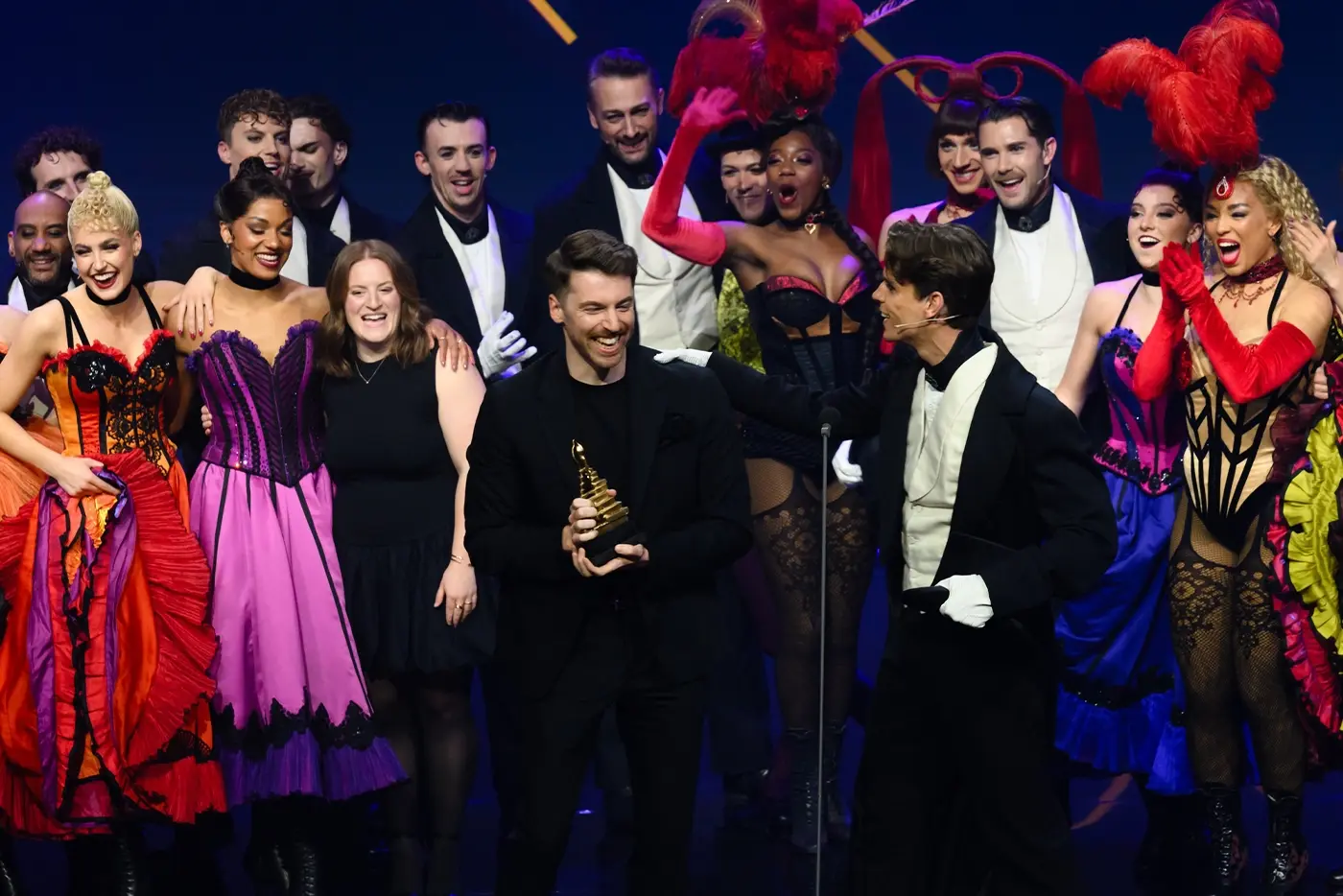 Cast of Moulin Rouge! The Musical in the Netherlands on stage accepting an award