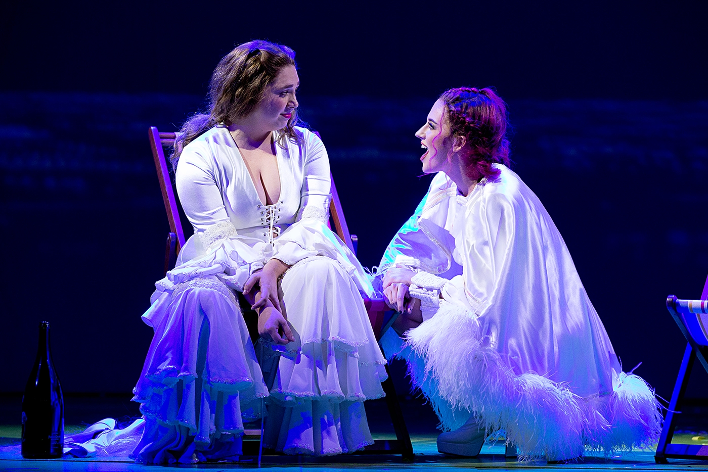 Muriel and Rhonda in white ABBA costumes talking