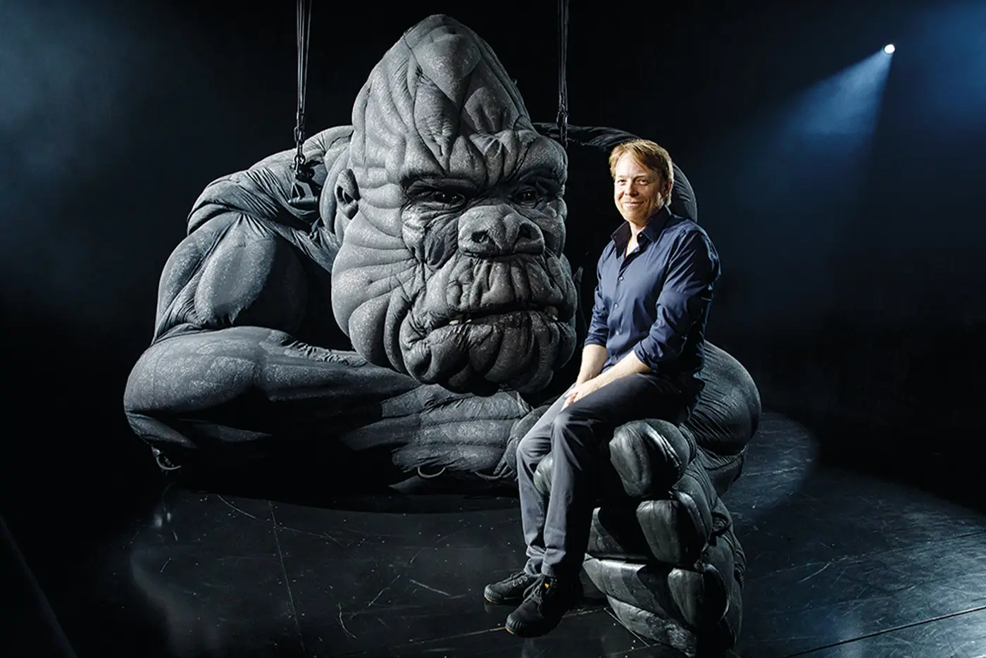 Sonny Tilders Creature Designer sitting on the hand of the King Kong puppet