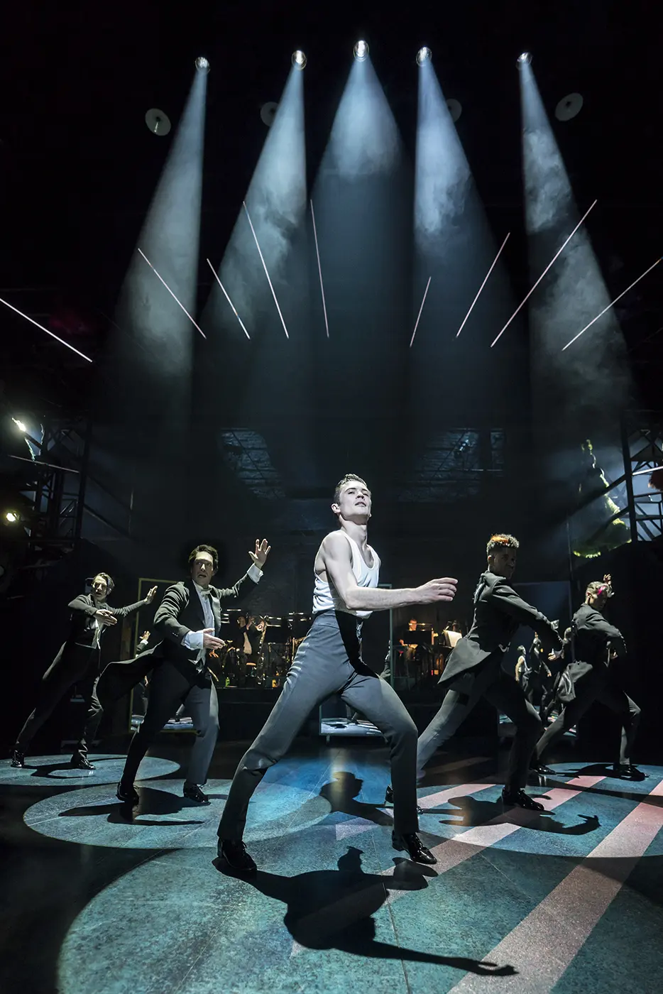 Scott dancing at the front position of a group of men