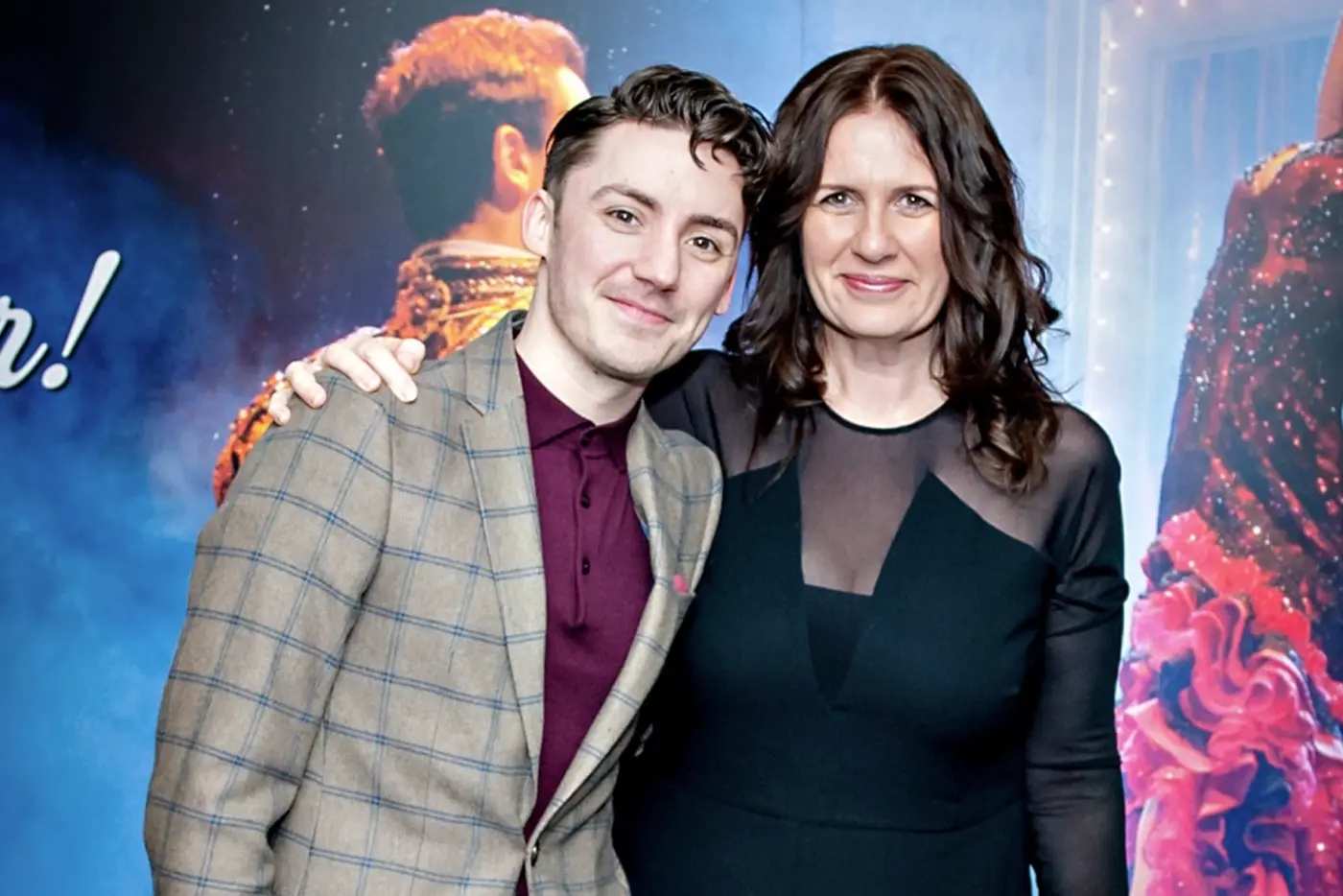 Director Drew Mconie and Producer Carmen Pavlovic infront of a poster from the musical