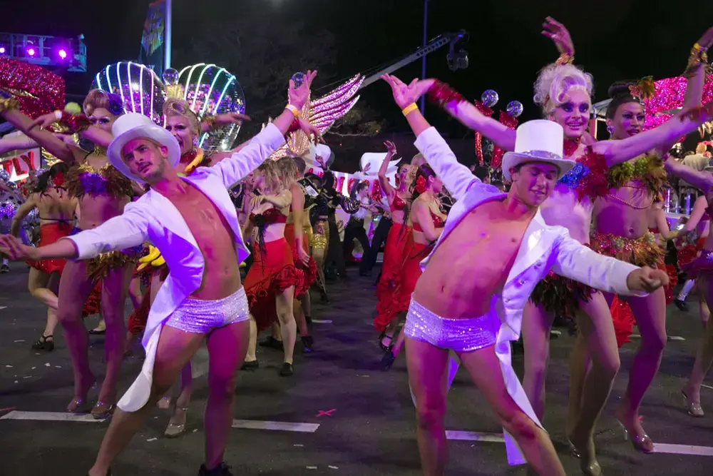 Cast from Strictly Ballroom the Musical dancing in the street participating in the 2014 Sydney Mardi Gras