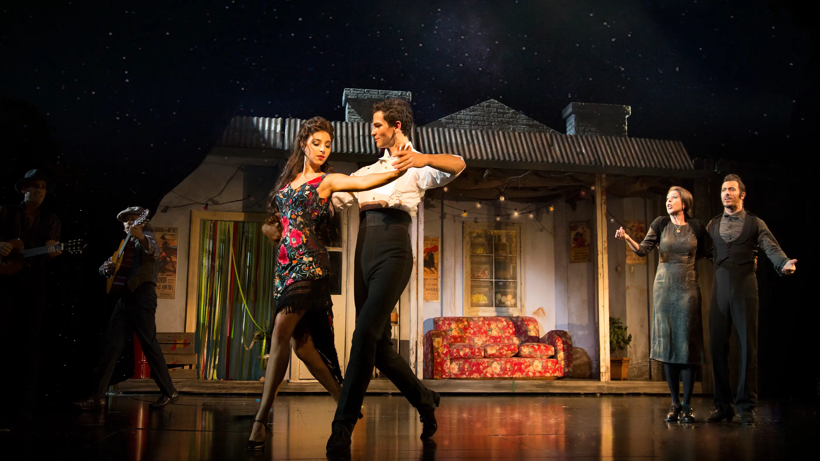 Fran and Scott dancing under the stars in a backyard.