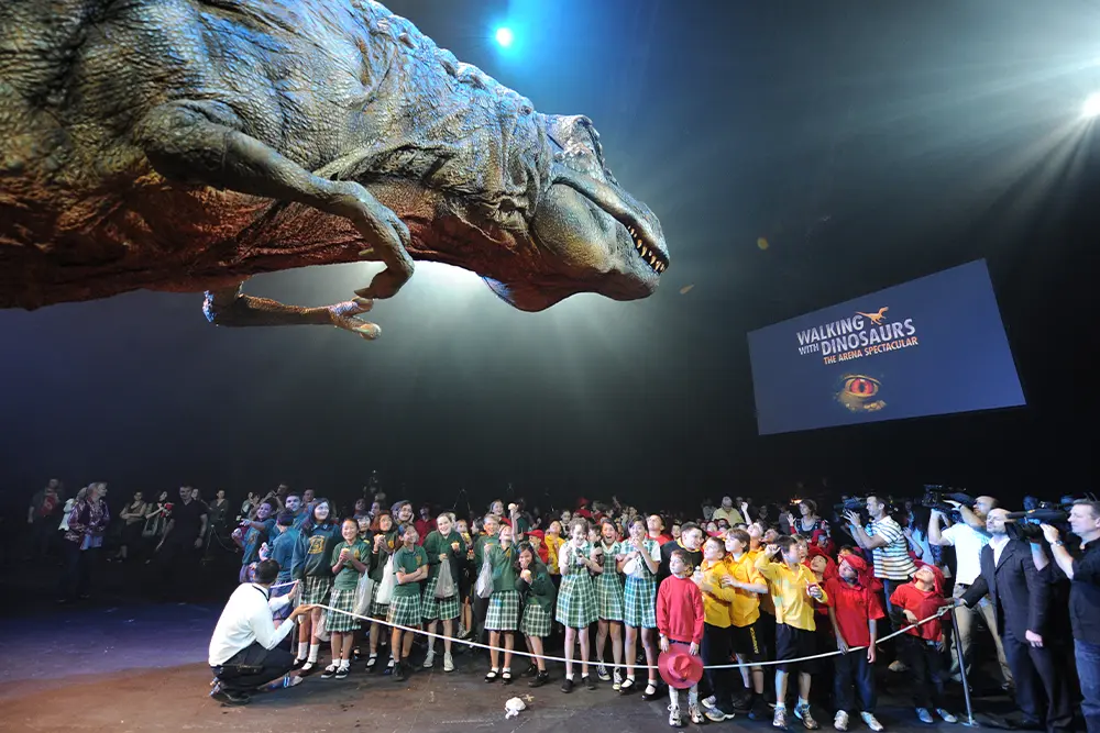 Dinosaur puppet from Walking with Dinosaurs - Arena Spectacular with school students.