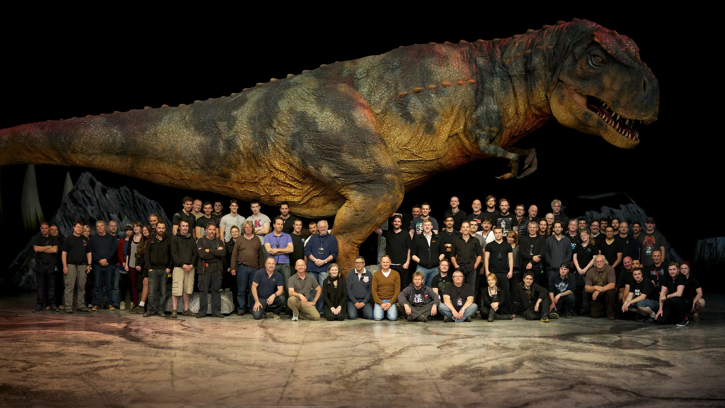 Cast and crew of Walking with Dinosaurs Arena Spectacular with T-rex puppet