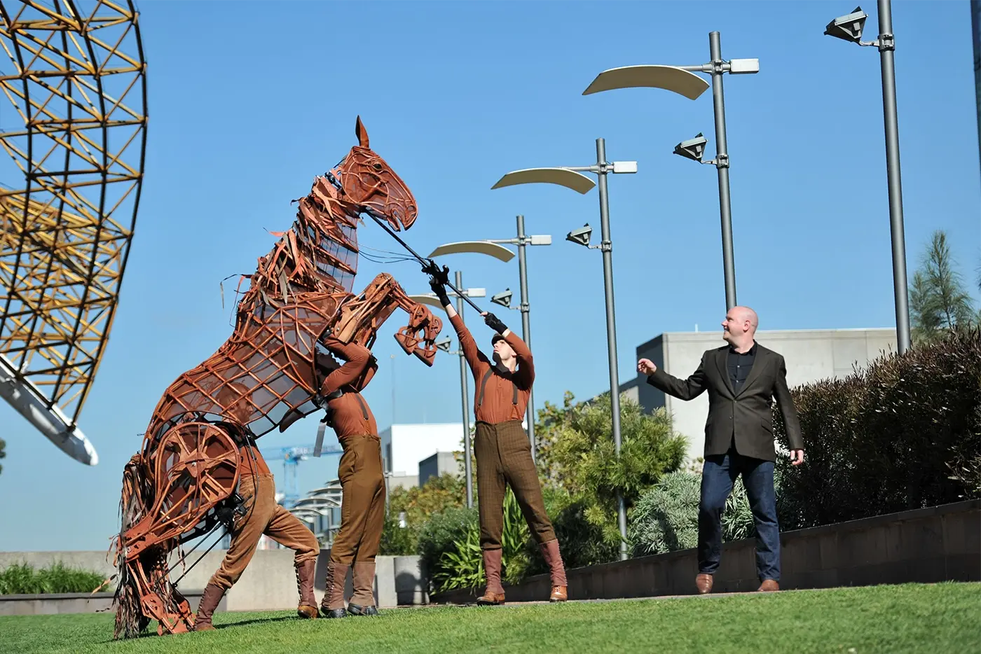 War Horse Australian Tour Associate Puppetry Director Finn Caldwell in action directing actors and a horse puppet.