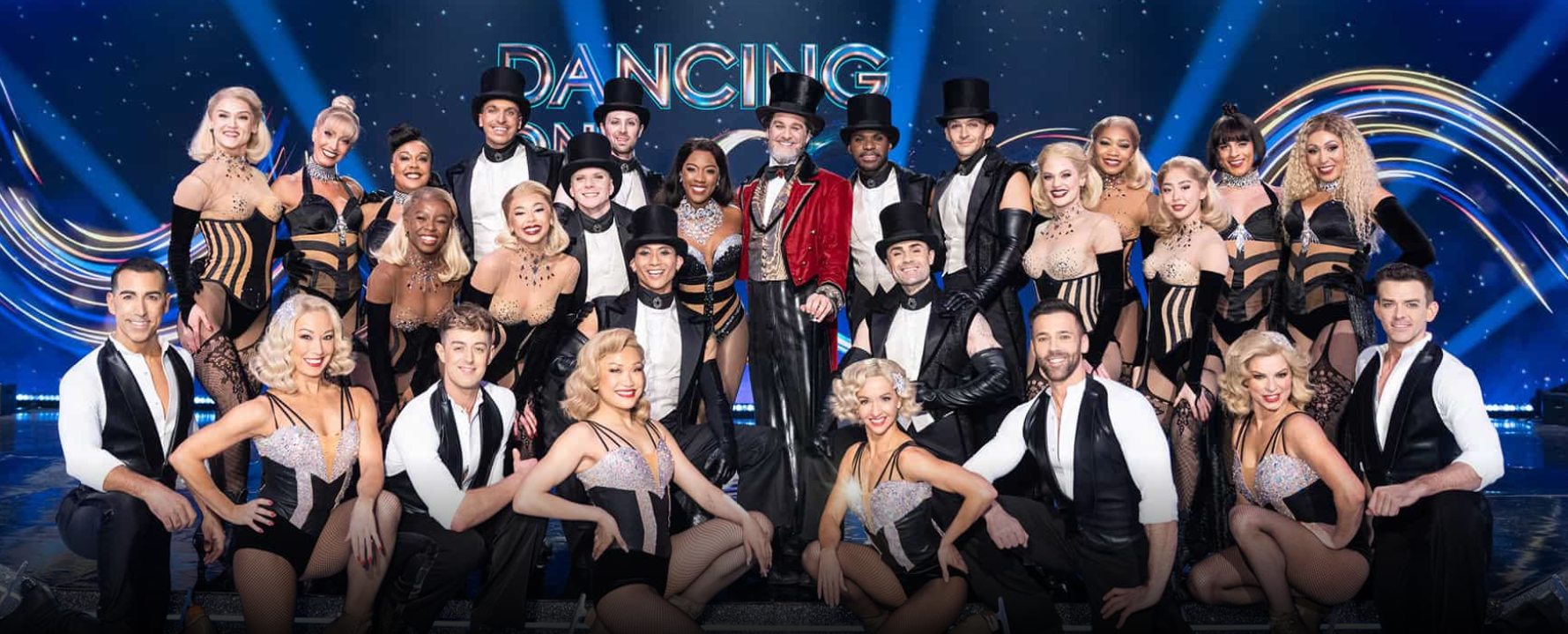The cast of Moulin Rouge! The Musical at Dancing on Ice. They wear their costumes from 'The Sparkling Diamond' scene which consists of sparkly corsets for the women, and sleeveless suits and vests with top hats for the men.